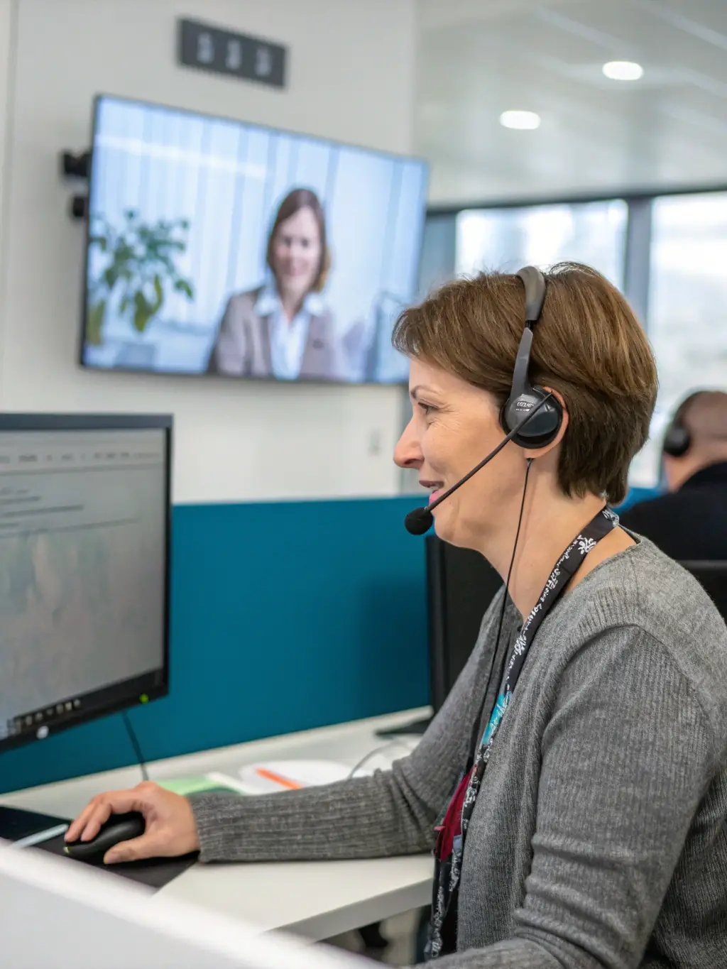 A Zest representative providing personalized mobile support to a client in a professional setting, emphasizing tailored service.